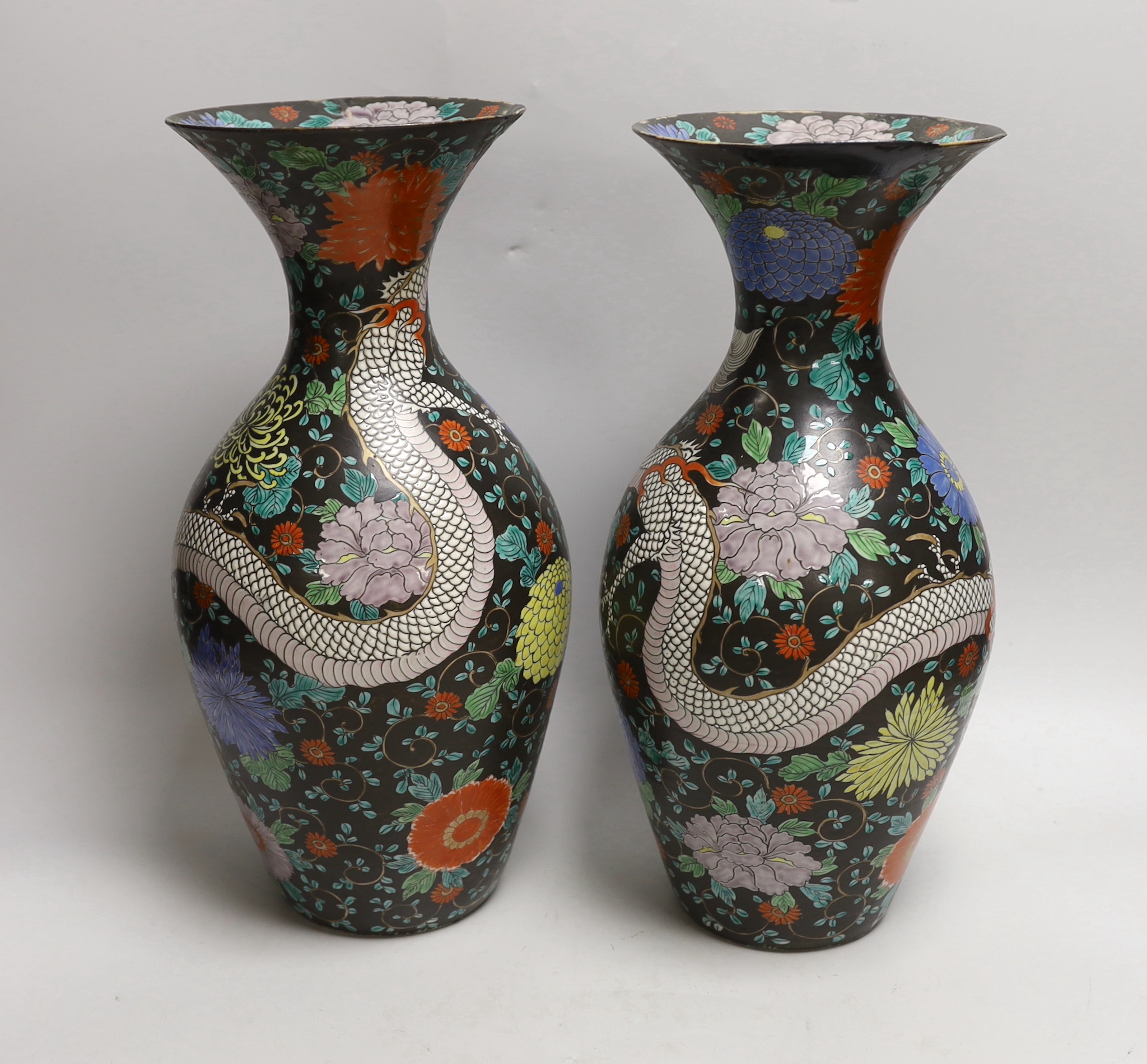 A pair of Japanese black ground ‘dragon’ vases, 37cm